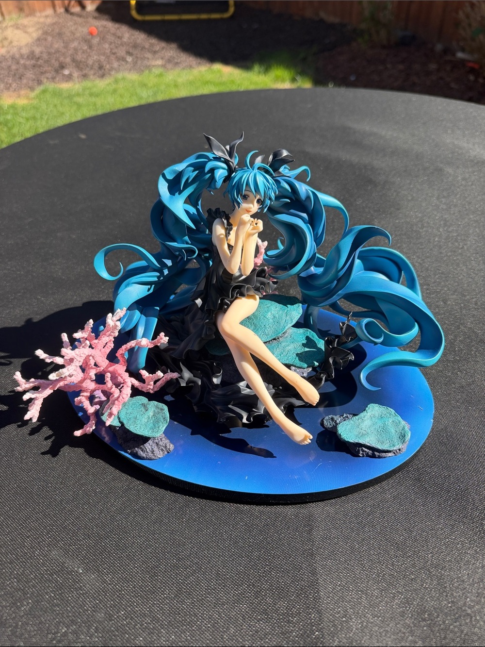 Blue Anime Figurine with Teal Hair on Ocean Base - Unbranded